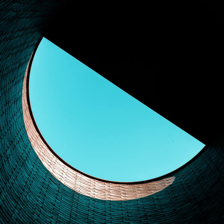 A low-angle photo of a statue's head